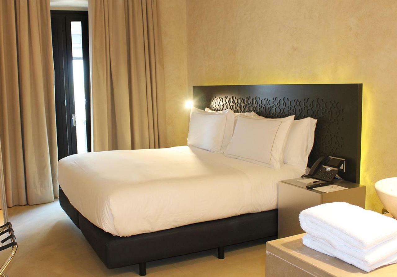Eme Catedral Mercer Hotel Sevilla Dış mekan fotoğraf A bedroom at the hotel